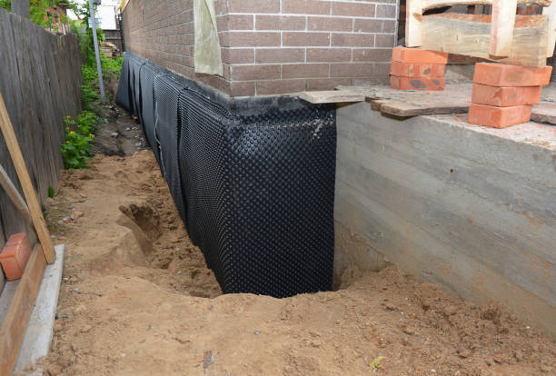Happy homeowners after waterproofing job in Allgood